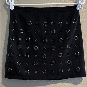 black mini skirt with eyelets. Size Medium